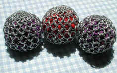 One red and two purple juggling spheres. Full size pic is 50.7 kb.